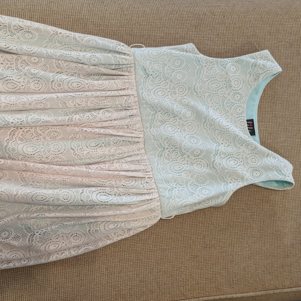 Cream lace overlay on teal satin dress